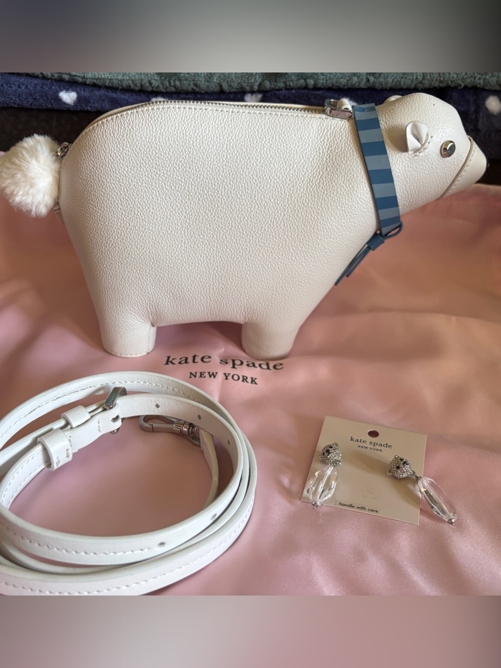 kate spade cream crossbody bag with pom-pom charm